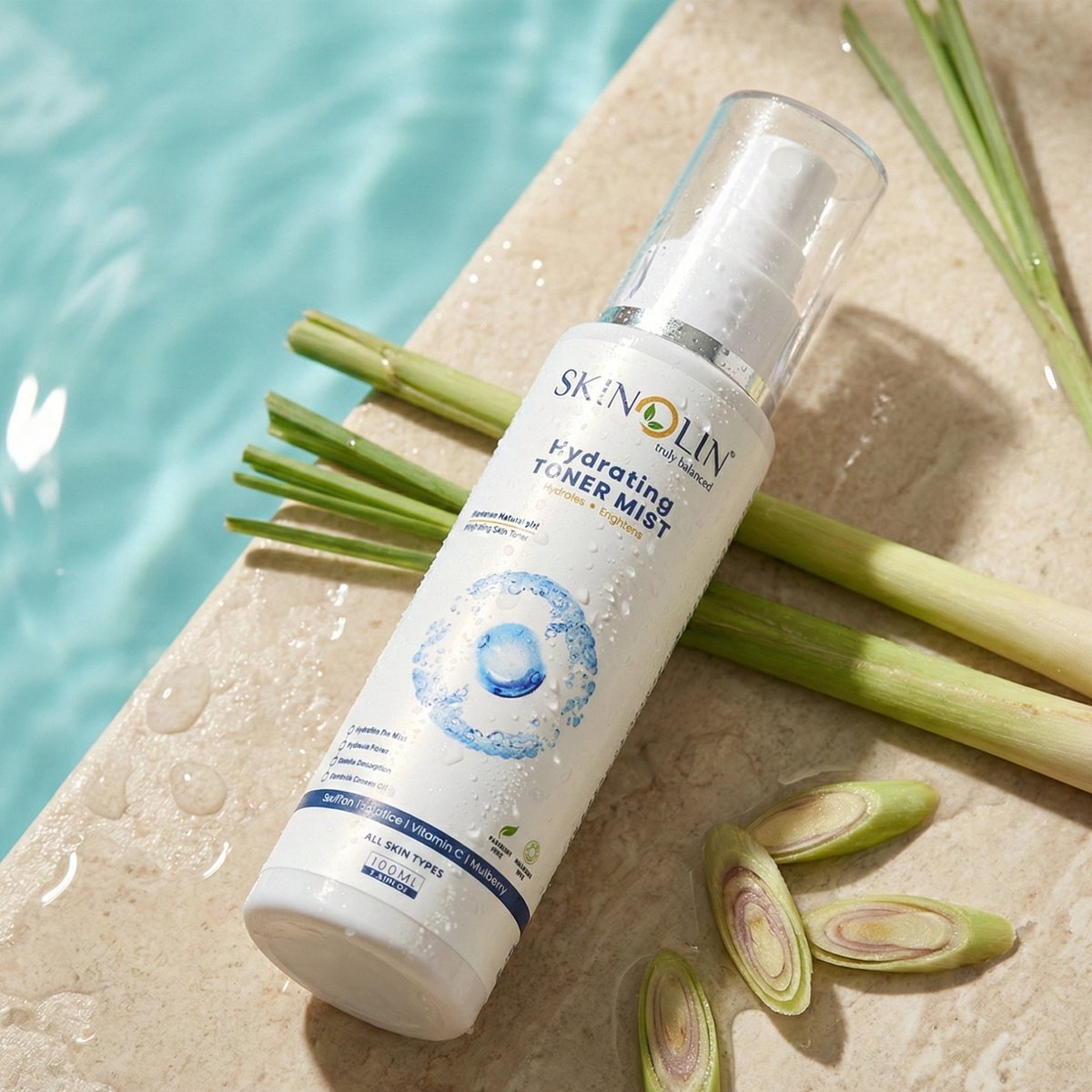 Skinolin Hydrating Toner Mist bottle on a stone ledge with fresh lemongrass