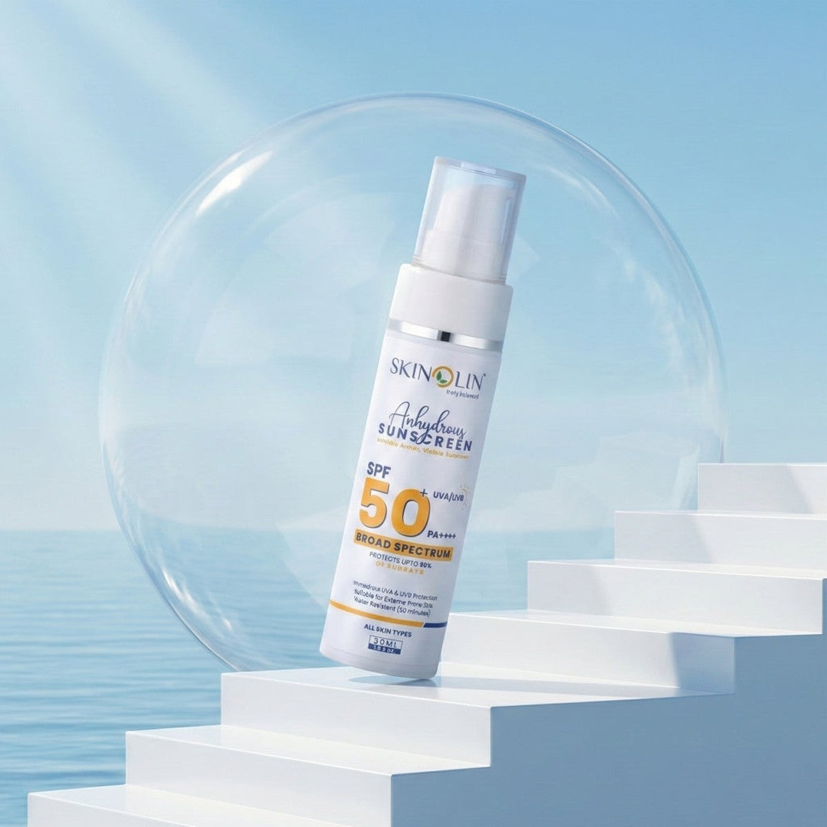 Skinolin Anhydrous Sunscreen SPF 50 PA++++ bottle inside a glass dome on white steps